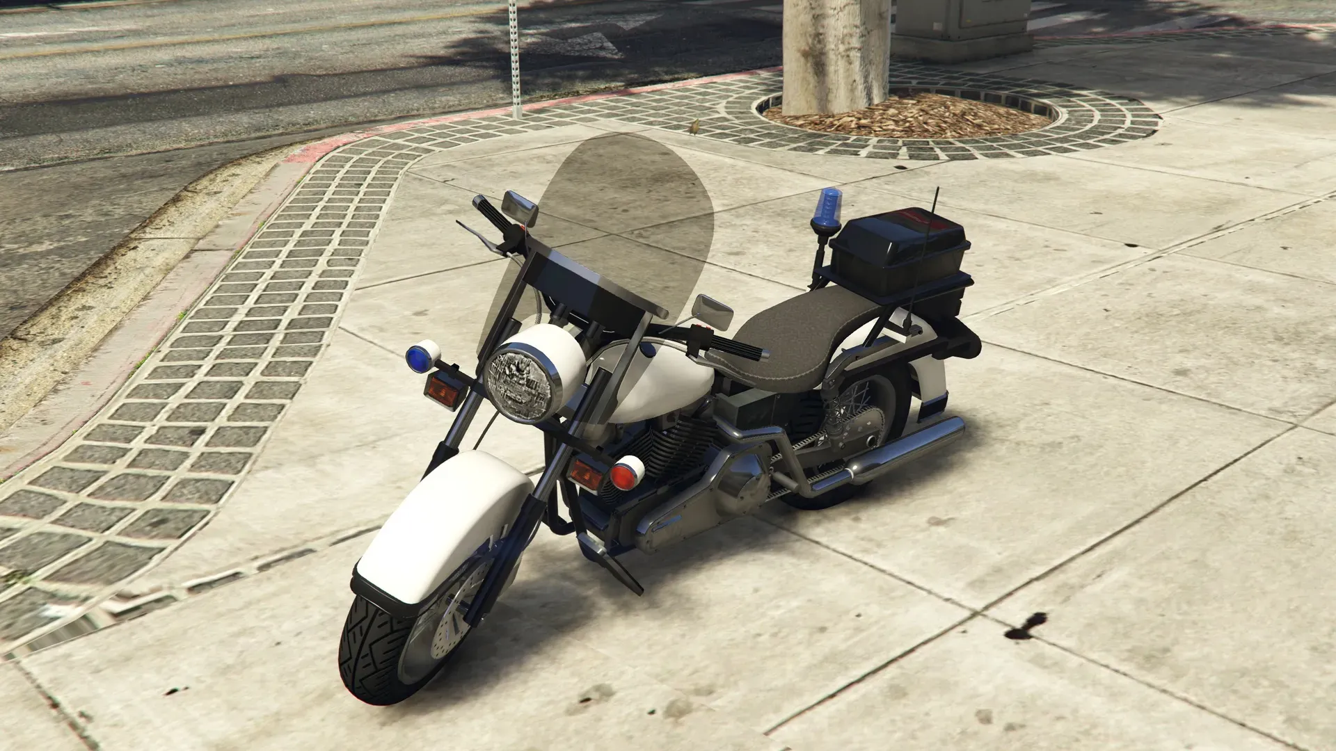 The white Western Motorcycle Company Police Bike parked on a sidewalk in GTA Online